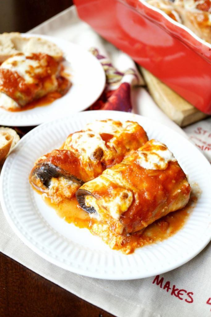Eggplant Rollatine · 3 pieces of fried eggplant, rolled with seasoned ricotta and Romano cheese, topped with sauce and melted mozzarella cheese.