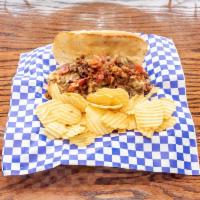 Kentucky Cheesesteak Sandwich · Your​ choice of steak or chicken, sauteed onion, bacon, and beer cheese. Served with chips.