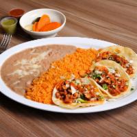 1. Taco Plate · 3 tacos with choice of meat, onions, salsa and cilantro. Served with rice and beans.
