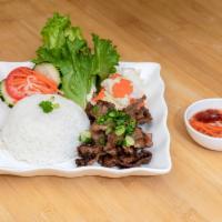 C2. BBQ Pork w/ Rice - Com Heo Nuong · Grilled marinated pork.
