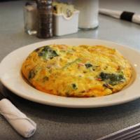 Fresh Vegetarian Omelette · Fluffy omelette filled with fresh broccoli, tomatoes, spinach, onions, mushrooms and aged ch...
