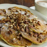 Georgia Pecan Pancakes · 6 Pancakes filled and topped with pecans. Dusted with powdered sugar, served with whipped bu...