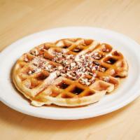 Georgia Pecan Waffle · Golden brown waffle filled and topped with Georgia pecans and lightly dusted with powdered s...
