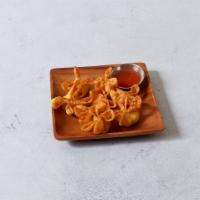13. Crab Rangoon · 8 pieces. Fried wonton wrapper filled with crab and cream cheese.