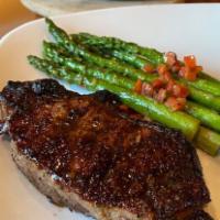 Center Cut New York Strip · 28 day aged NY strip steak served with roasted garlic and a choice of 1 side. Add protein fo...