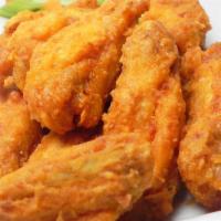 Fried Chicken Wings · Fried chicken wing with teriyaki sauce.