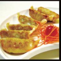 Gyoza · Pan-fried pork dumplings or veggie dumplings.