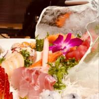 Sashimi Deluxe · Raw. 16 pieces raw fish filet and California roll.