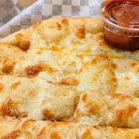 Classic Cheesy Bread · Buttery bread sticks topped with whole milk mozzarella cheese. Made to order with love using...