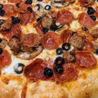 Combo Pizza · A classic combination sure to please any crowd. Pepperoni, mushroom, black olive, Italian sa...