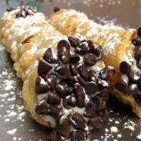 Chocolate Chip Cannoli · The first cannoli made here in the shop. Rich vanilla cream with loads of mini dark chocolat...