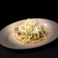 Sopes · Handmade thick tortilla, covered with refried beans, the meat of choice, lettuce, cheese and...