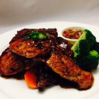 Grilled Pork Chop · Marinated with garlic pepper served with mixed vegetables and sticky rice.