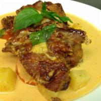 Crispy Roasted Duck · Pineapple, cherry tomatoes, long hot, basil and red curry sauce. Spicy.