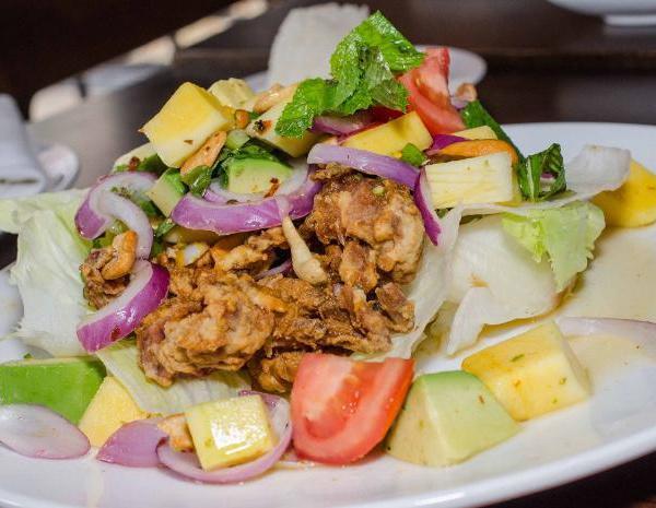 Rain Soft Shell Crab · Fried soft shell crab with mango, avocado, red onion, cashew nuts with spicy lime dressing. 