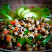 Sautéed Black eyed peas & greens · Grandmother’s soul food receipe cooked in trans fat free olive oil infused with spices and t...