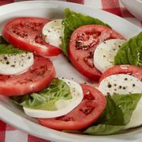 Tomato Mozzarella · With a basil pesto dressing.