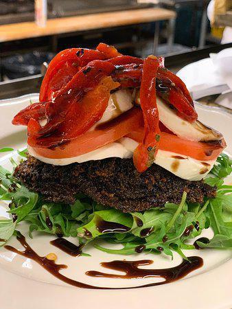 Portobello Napoleon · Oven Roasted Sweet Red Peppers, Fresh Mozzarella, Portobello Mushrooms Topped w/Melted Swiss, Finished in a Balsamic Reduction.

