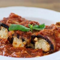 Eggplant Rollatini · Battered eggplant, rolled and filled with ricotta cheese, parmesan and mozzarella, baked wit...
