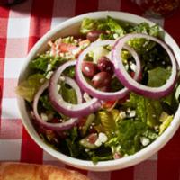 Mediterranean Salad · Hearts of romaine, black olive, red onion, crumbled feta, and pepperoncini peppers in a red ...