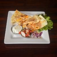 CHICKEN QUESADILLA · Chicken, cheddar-jack cheese and smoked onions in a flour tortilla. Served with pico de gall...