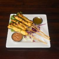 CHICKEN SATAY SKEWERS · Grilled chicken with peanut sauce and cilantro vinaigrette.