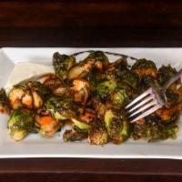 BRUSSEL SPROUTS · Crispy Brussel sprouts lightly salted with red pepper vinaigrette, balsamic syrup reduction,...