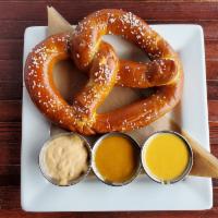 HOUSE BAKED PRETZEL · Freshly baked pretzel with Redmond's cheese sauce, honey mustard, and chipotle aioli.
