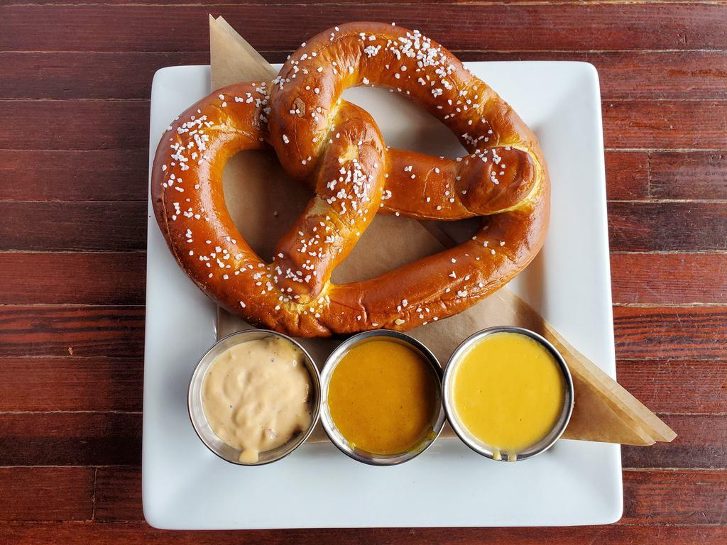 HOUSE BAKED PRETZEL · Freshly baked pretzel with Redmond's cheese sauce, honey mustard, and chipotle aioli.