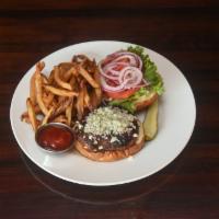 BLACK AND BLEU · Blue cheese crumbles, creole spices, tomato, lettuce, onion and roasted garlic mayo on a pre...