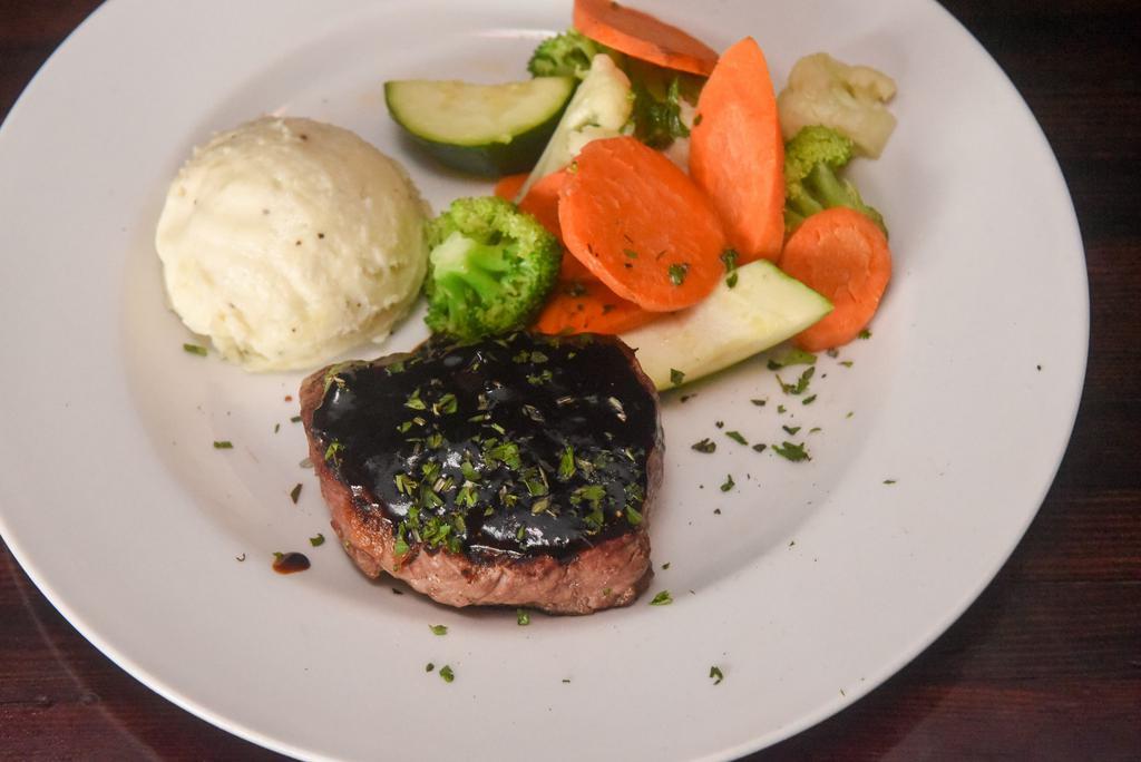 FILET MIGNON · 7oz Filet grilled to order, Cabernet demi-glace and seasonal vegetables. Choice of garlic mashed potatoes or herb roasted fingerlings.
