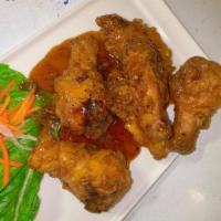 Chicken Wings · 6 fried chicken wings marinated in a house special sauce.