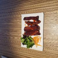 Barbecue Pork Spareribs  · 4 barbecue spare ribs marinated in a house sweet sauce