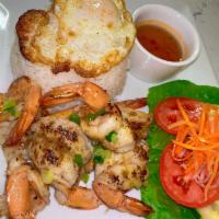 Grilled Lemongrass Jumbo Shrimp with Rice Platter · Served with vietnamese broken rice, lettuce, tomato, cucumber, scallion, a sunny side up egg...