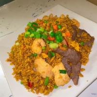 House Fried Rice · Served with baby shrimp, barbecue pork, chicken, onion, scallion, pea and carrot 