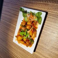 Sweet and sour chicken  · Served with white meat breaded chicken, pineapple, red and green bell peppers tossed in a ri...