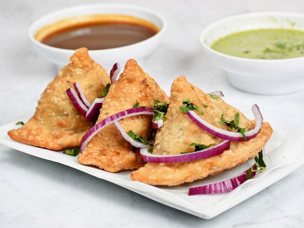 3 Pieces Samosa · Hand rolled pastry stuffed with potato and green peas.