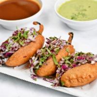 Onion Mirchi Bajji (3 Piece) · Whole jalapenos fried with spiced chick pea flour and stuffed with onions.