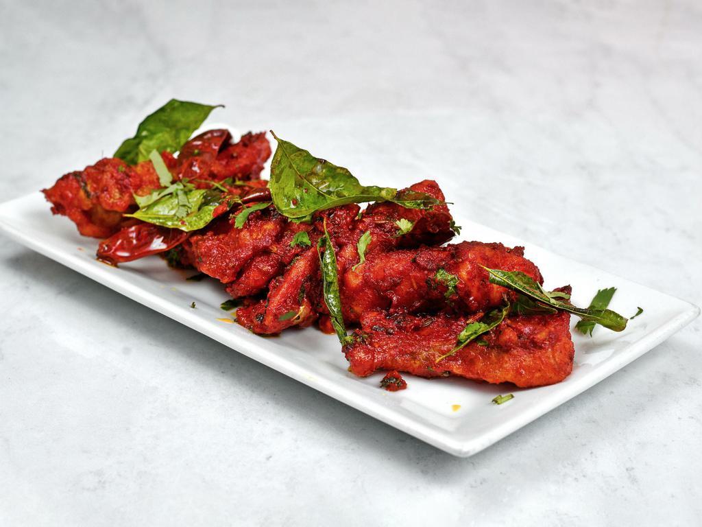 Apollo Fish Fry · Chef s special spiced fish cubes deep fried and sautéed with salted green chillies.