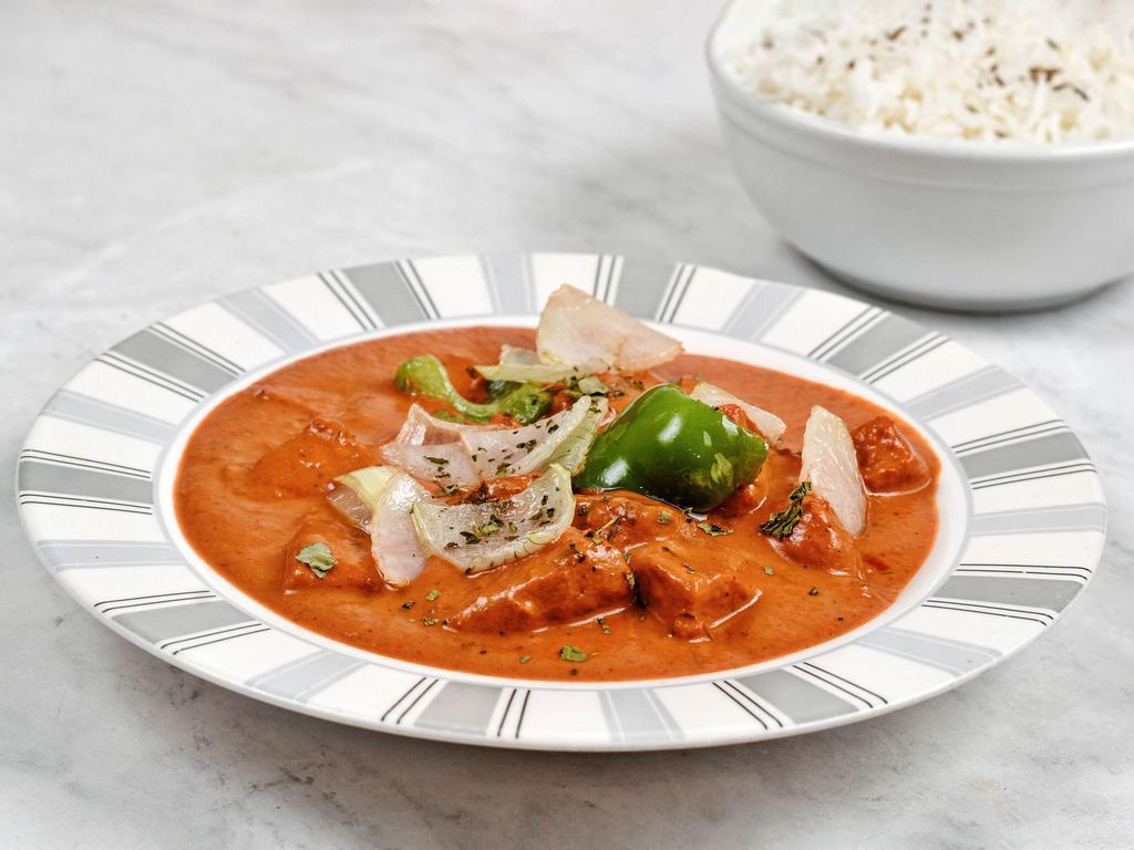 Tikka Masala Curry · Mild, creamy tomato based curry with house special herbs and simmered with protein of your choice! 