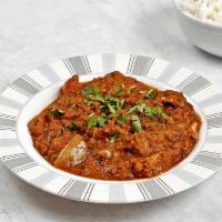 Kadhai Curry · Semi-dry curry simmered with diced onions, peppers, tomatoes, whole spices, and protein of y...