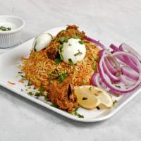 Gongura Chicken Biryani · Boneless chicken breast sautéed with Andhra regional sauce topped on a bed of slow cooked se...