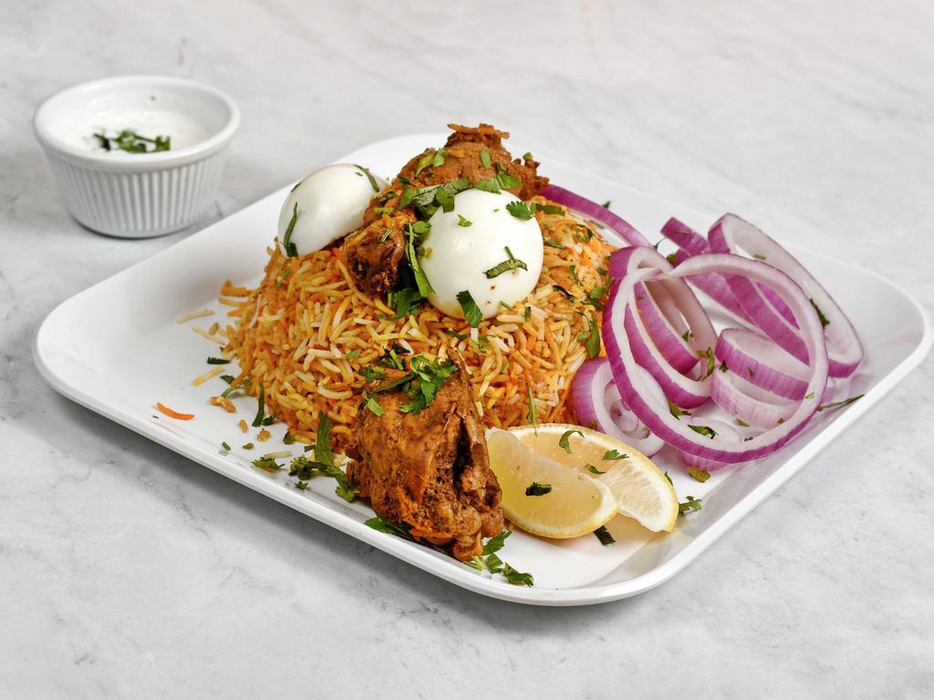 Gongura Chicken Biryani · Boneless chicken breast sautéed with Andhra regional sauce topped on a bed of slow cooked seasoned rice specialty.