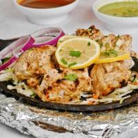 Achari kabab · Boneless succulent chicken pieces Marinated in thick yogurt, traditional Indian pickle, herb...
