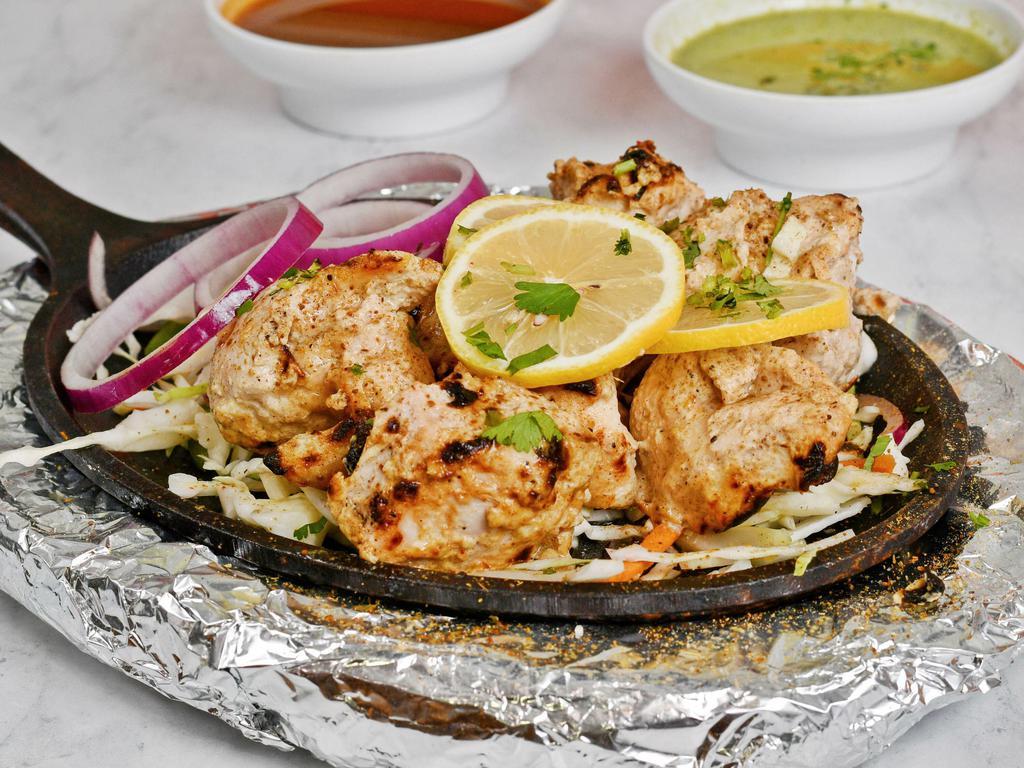 Achari kabab · Boneless succulent chicken pieces Marinated in thick yogurt, traditional Indian pickle, herbs and spices