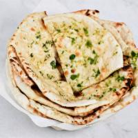 Garlic Naan · Traditional Indian bread baked in clay oven with a hint of fresh garlic.