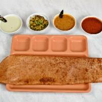 Masala Dosa · Fermented rice crepe grilled to perfection stuffed with masala mashed potatoes served with s...