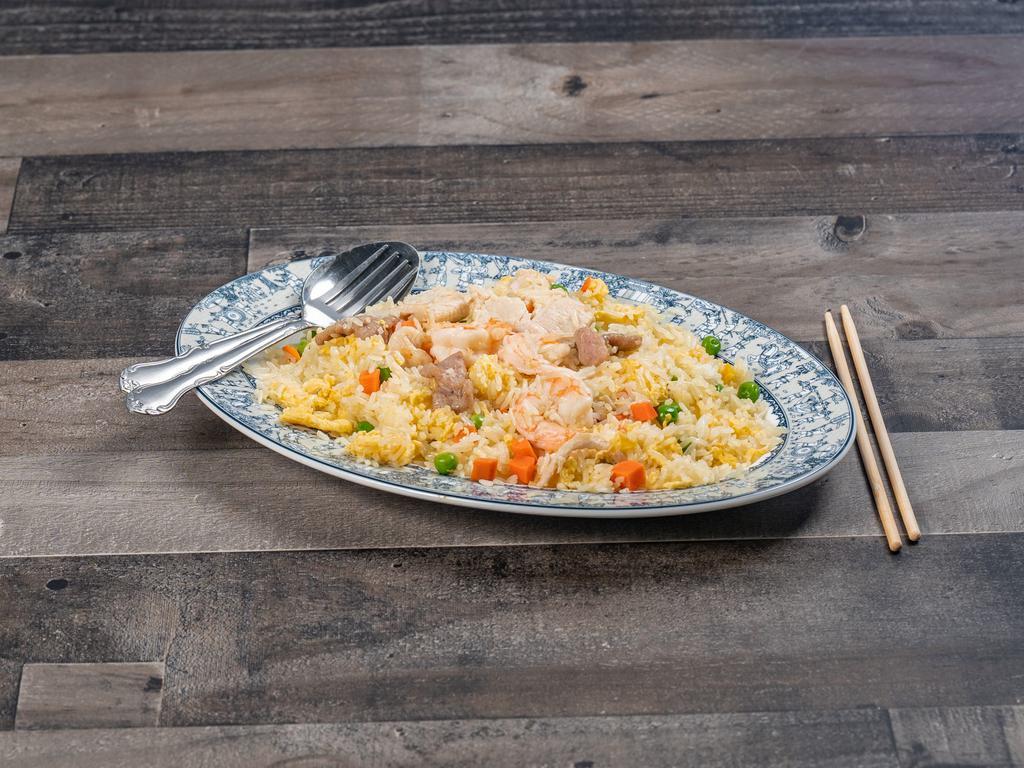 F2. Combination Fried Rice · Rice stir-fried with peas, carrots and eggs with beef, chicken and shrimp.