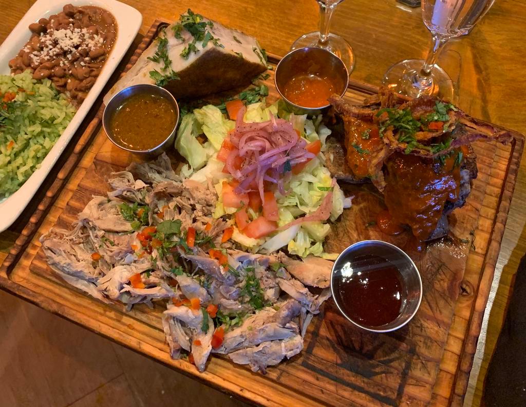 Salud Exclusivo (Serves 2) · Bone In Rib Covered In A 3 Chiles Mole/Duck Carnitas/Pork Belly Chicharron/Side Of Cilantro Rice And Refried Beans/2 Cheese Enchiladas