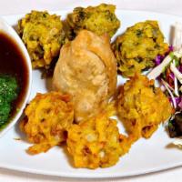 Vegetable Treat (V) · Samosa, onion and spinach fritters.